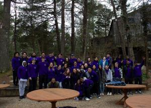 Group photo of students outside in the woods