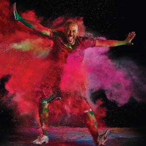 Aaron Tolson dancing in a cloud of colored smoke