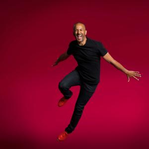 Aaron Tolson jumping in the air with tap shoes