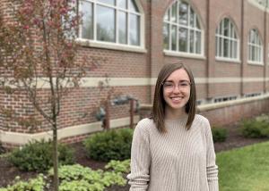 Meaghan Wilson in front of Roger and Jean Francine Student Center