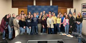 NHIOP student ambassadors gather around Karoline Leavitt