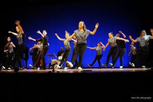 Students dancing in formation in the Koonz Theater