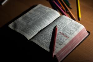 An open Bible sitting on a table