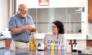 Professor Brian Penney with a student