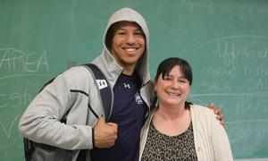 Ahmad Brown ’24 stands with Professor Marigen Learnard