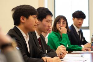 Group of students participating in debate at Ethic Bowl