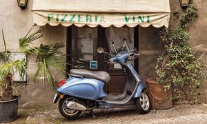 A moped rested in front of a store