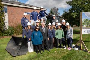 Roger Jean, Francine Jean, and Beverly Grappone with Saint Anselm College Students