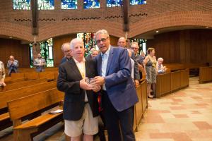 Thomas Bullock ’74 and President Joseph Favazza inside the Abbey Church