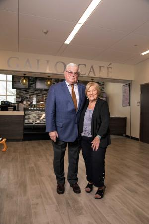 Walter Galllo ’58, H.D. ’08, and his wife, Julie, stand in the newly opened Gallo Café in 2018 during the ribbon cutting of the Roger and Francine Jean Student Center complex.