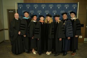 From left: Rev. Augustine Kelly, O.S.B. ’83, Joseph M. Horton, Ed.D. ’77, Carole McGinness Cafferty ’88, Captain Mary Jo O’Dwyer Majors, R.N., M.S.N., Nurse Corps, U.S.N.R. (Ret.) ’69, Lauren Chooljian Baier ’10, Robert F. Savard, Jr. ’71, College President Joseph A. Favazza, Ph.D., and Joseph Loughrey, chair of the Board of Trustees