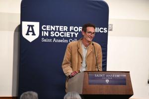 Stefan Reynolds speaking behind a podium