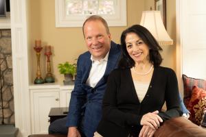 Man and a woman photographed in their home