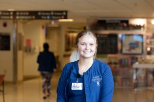 Caitlin Sullivan '25 dressed in scrubs for her preceptorship at South Shore Hospital