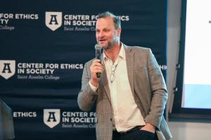 Max Latona speaking at a Center for Ethics event