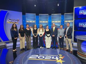 Student ambassadors standing on the set of WMUR