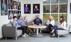 Students sitting discussing mental health