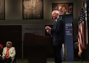 Asa Hutchinson speaks at a podium at the NHIOP