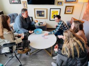 Students volunteers playing a game of card during service