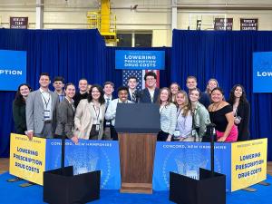 Students behind the podium where President Biden delivered a speech on lowering prescription drug costs