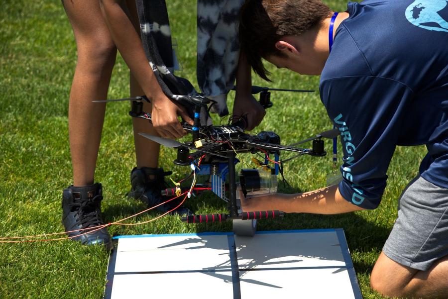 Students work on a drone