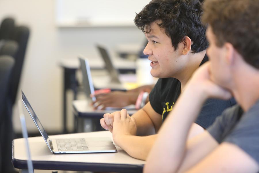 Students sit in a classroom