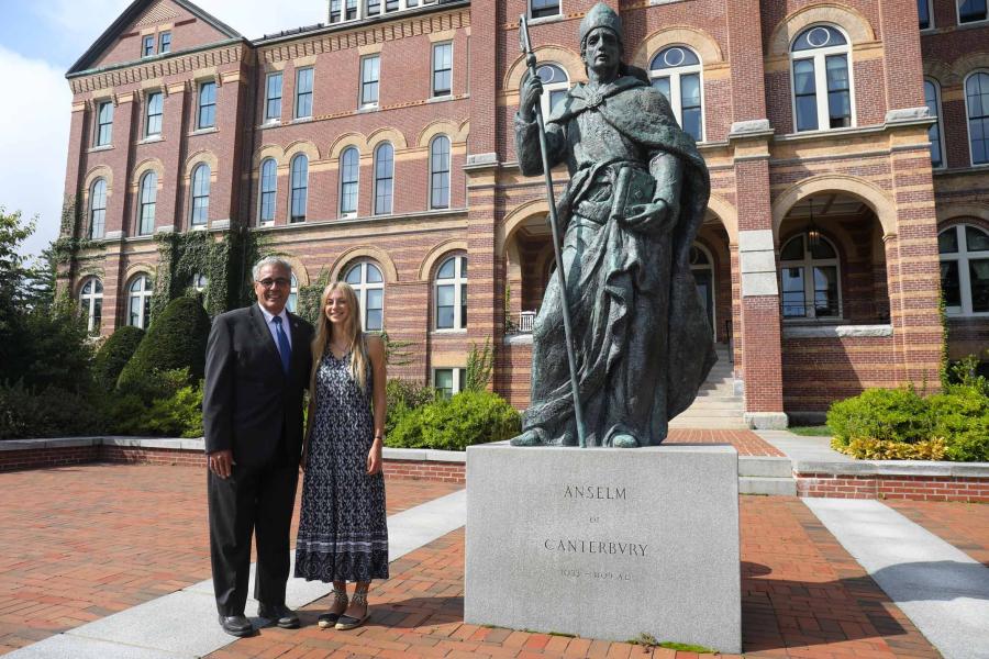 Dr. Favazza and Holmes Scholar Mary Kocey standing next to the statue of St. Benedict