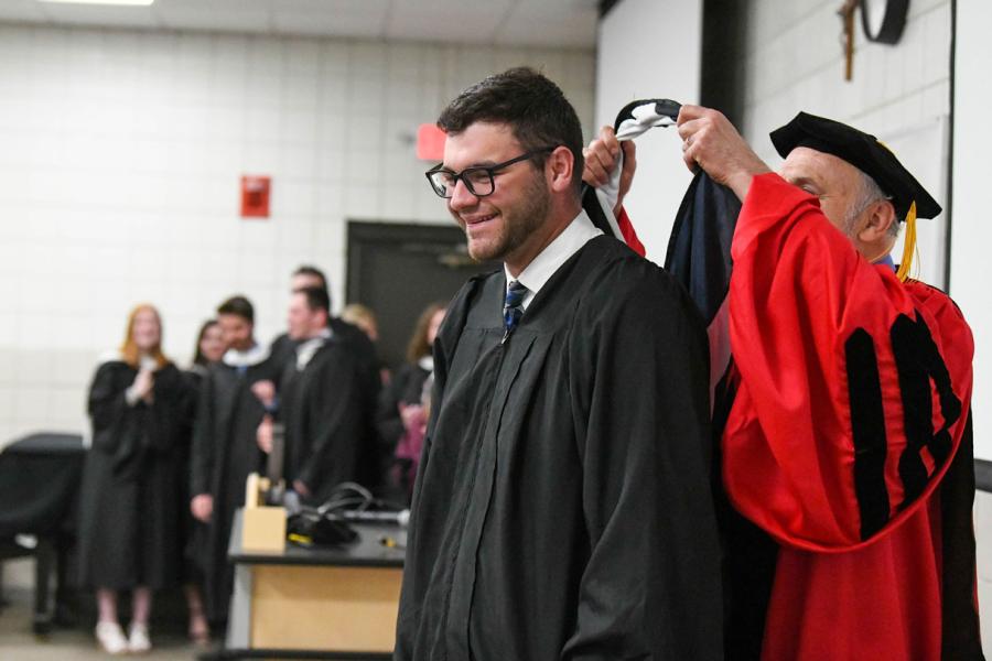 CJ Master's student receiving his hood